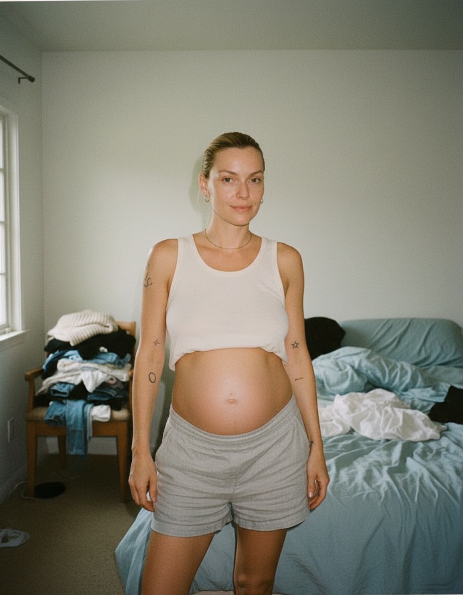 New mother holding her newborn postpartum