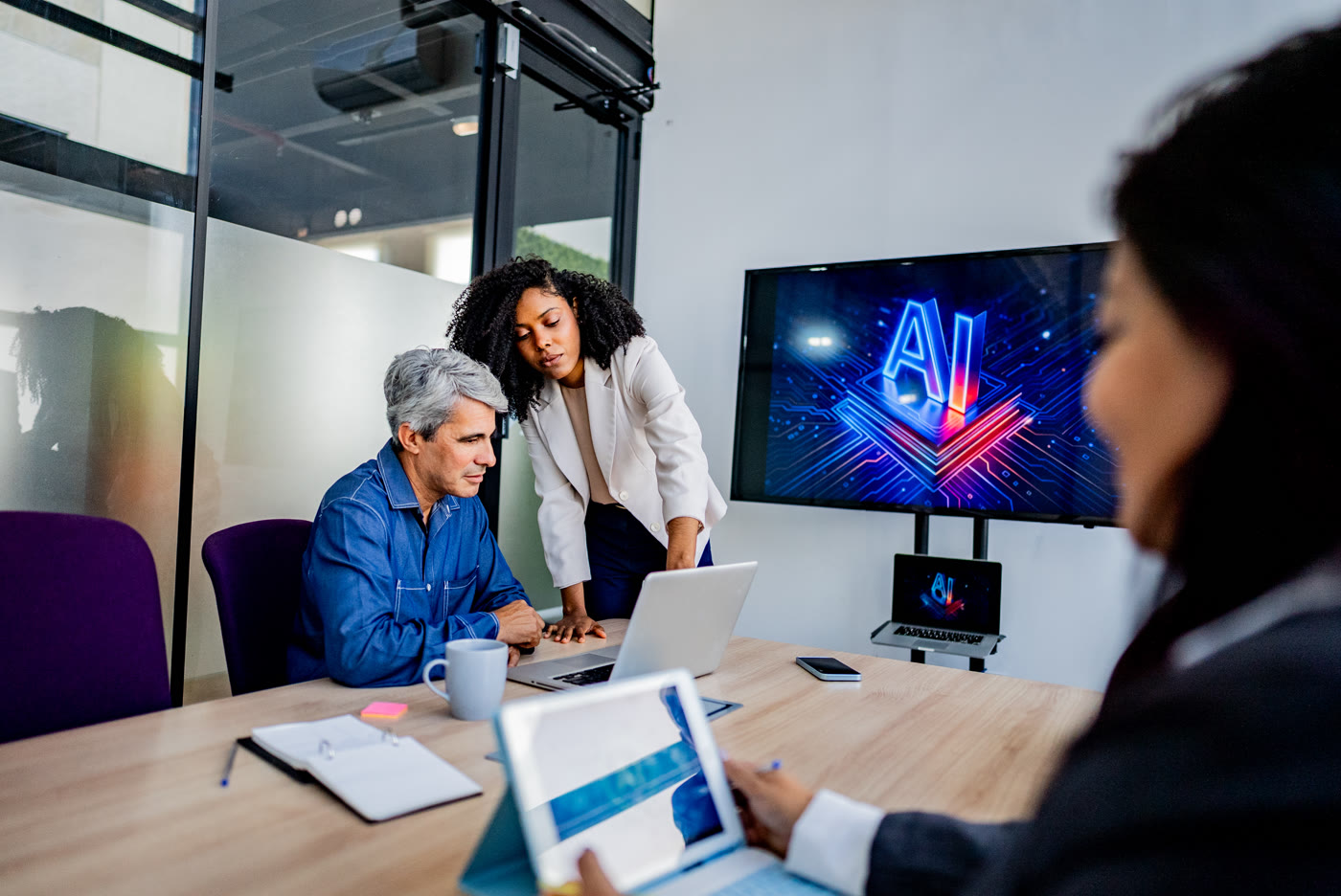 Team of professionals working through a session in a meeting room